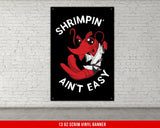 A white, checkered-patterned fabric is rolled up and secured with a gold ring, which is fastened with a gold ring.