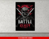 a poster of a skull with two swords on a brick wall