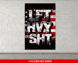 a red white and blue poster on a white brick wall