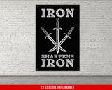 a black iron sign with two swords on it