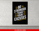 a picture of a black and yellow poster on a white brick wall