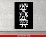 A white, checkered-patterned fabric is rolled up and secured with a gold ring, which is fastened with a gold ring.