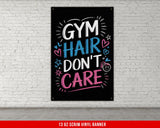a gym sign on a brick wall with the words gym hair don't care