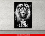 a black and white picture of a lion on a brick wall