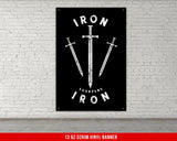 a white brick wall with a black and white iron sign on it