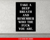 a black and white poster on a white brick wall