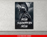 a black and white photo of a spartan poster on a brick wall
