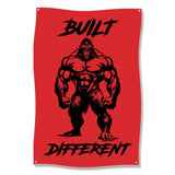 Muscular gorilla silhouette with "BUILT DIFFERENT" text on red background.