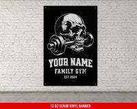 a poster of a skull with a barbell on a brick wall