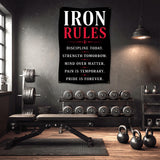 Gym wall banner with "IRON RULES" and motivational phrases.