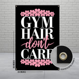 Gym Hair Don't Care banner with pink floral accents and reinforced grommets.