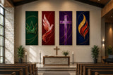 a church interior with a wooden pews, a cross, and four colorful paintings on the walls.
