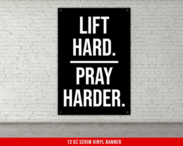 a man standing next to a tall black box