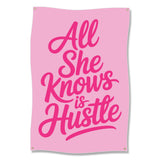 Pink banner with bold pink text "All She Knows is Hustle".