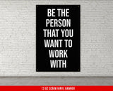 a black and white poster on a white brick wall