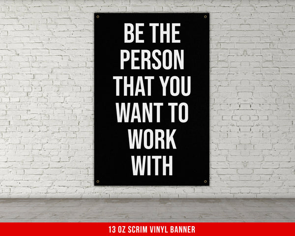 a black and white poster on a white brick wall