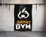 Jordyn's Gym logo with athletic woman on a black background.