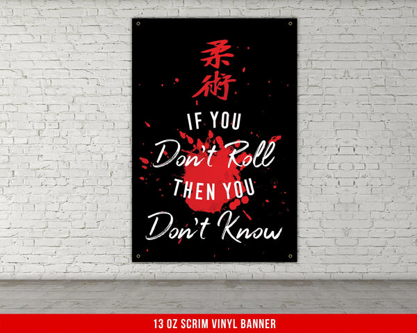 A white, checkered-patterned fabric is rolled up and secured with a gold ring, which is fastened with a gold ring.