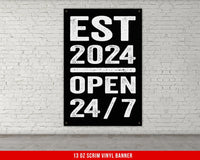 a black and white sign on a white brick wall