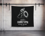 a black banner hanging on a wall with a picture of a man holding a tire