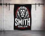 Black towel with white "SMITH HOME GYM" text and a roaring lion illustration.