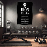 Banner with "Iron Rules" and motivational quotes hanging in a gym.
