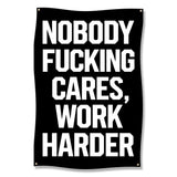 Black banner with white text: "NOBODY FUCKING CARES, WORK HARDER."