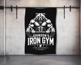 Johnson's Iron Gym bear logo with "No Excuses" text on a black banner.
