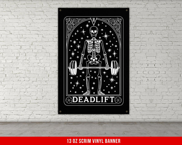 a black and white picture of a skeleton holding a barbell