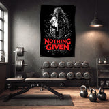 Spartan helmet banner with "Nothing Given" text in a gym.