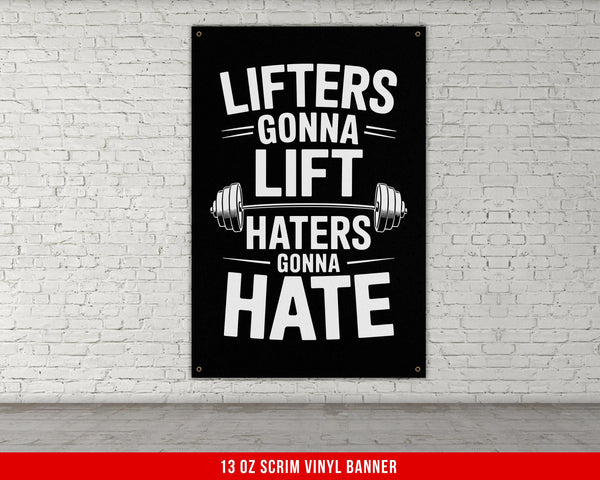 a black and white poster hanging on a white brick wall