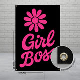 Pink "Girl Boss" text with flower graphic and grommet detail on black banner.