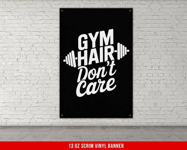 a gym poster hanging on a white brick wall