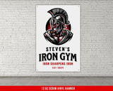 a white brick wall with a sign that says iron gym