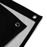 a close-up view of a black and white fabric with two circular holes, one on each side.