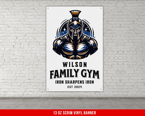 a white brick wall with a sign on it that says wilson family gym iron sharpe
