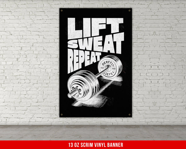 a black and white picture of a barbell on a brick wall