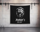a black wall hanging with a picture of a lion