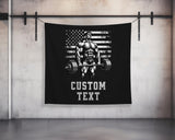 a black wall hanging with a picture of a man lifting a barbell