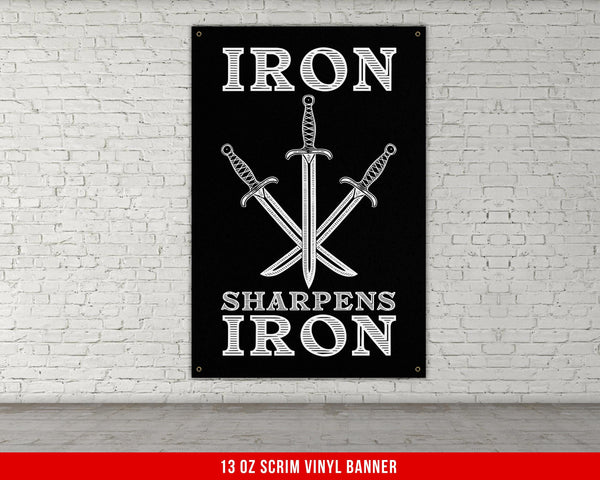 a black iron sign with two swords on it