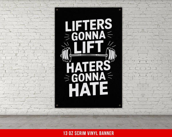 a black and white poster hanging on a brick wall