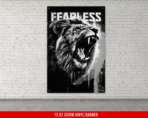 a black and white picture of a lion with its mouth open