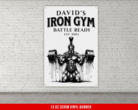 a poster of a man lifting a barbell in front of a brick wall