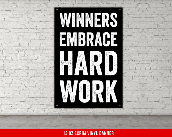 a sign that says winners embrace hard work