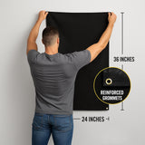 A man is hanging a black banner on a wall, with measurements provided.