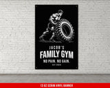 a black and white poster of a man holding a tire