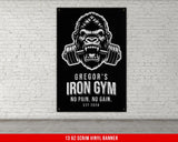 a gorilla with a barbell in his mouth on a brick wall