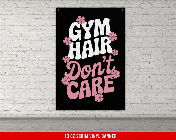 a gym sign on a brick wall that says gym hair don&#39;t care