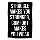 Black banner with white text: "STRUGGLE MAKES YOU STRONGER, COMFORT MAKES YOU WEAK".