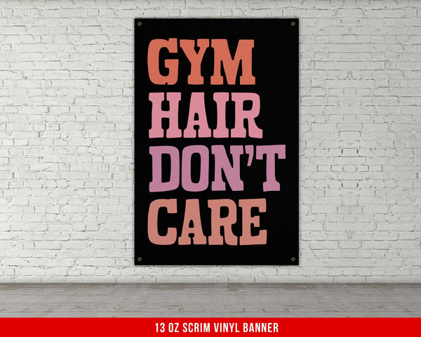 a gym sign on a brick wall that says gym hair don&#39;t care